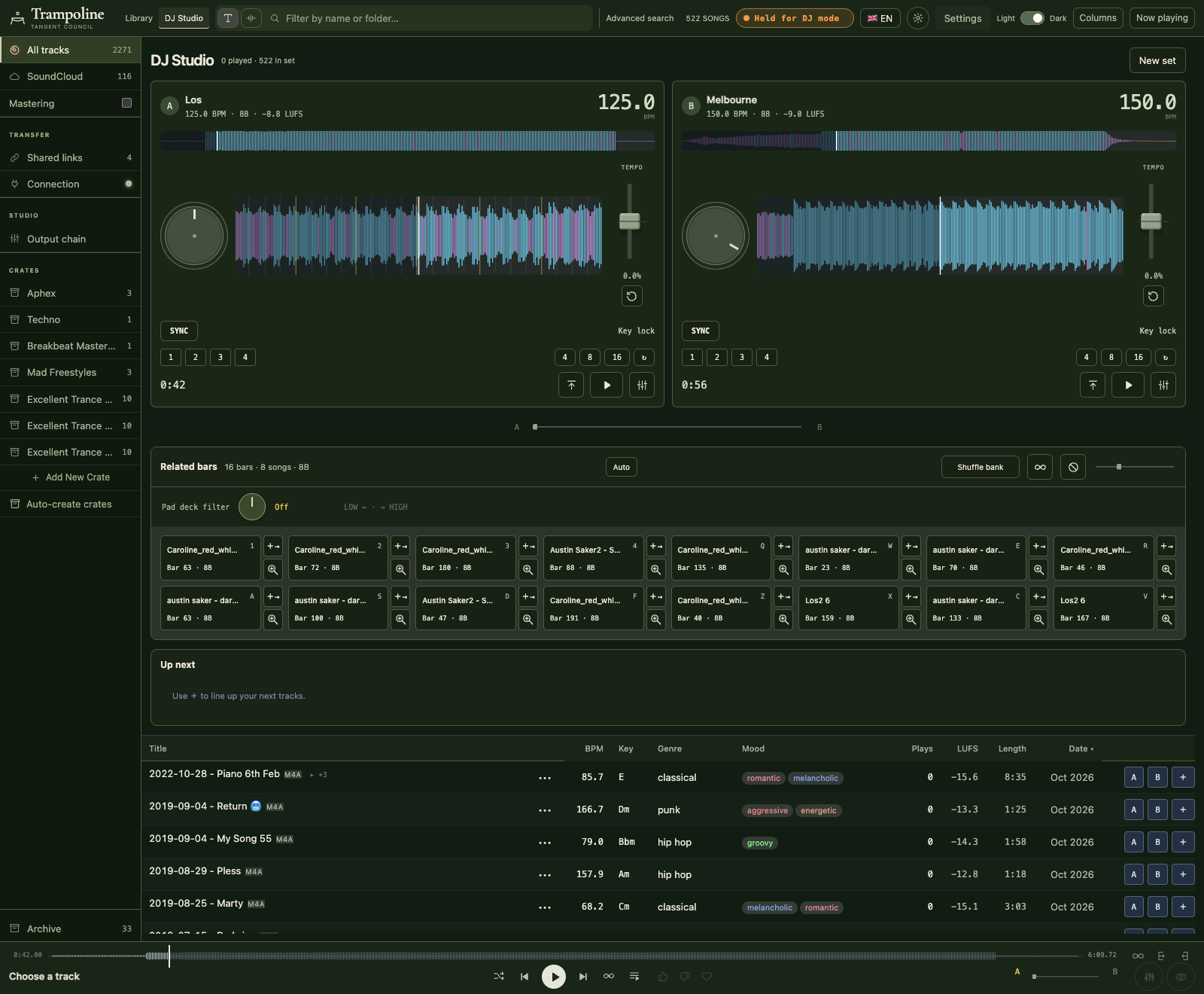 The current DJ Studio with two loaded decks, waveforms, vertical tempo faders, and the track browser.